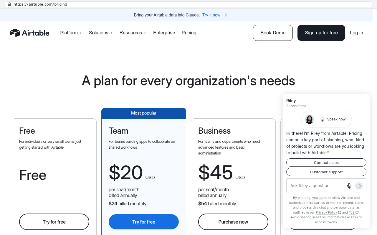 Airtable pricing page showing three plan options with Team plan at $20 USD per seat per month billed annually and Business plan at $45 USD per seat per month billed annually, clearly indicating headcount-based pricing